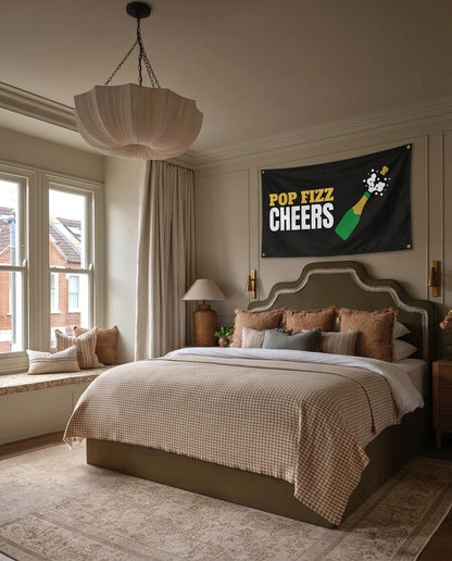 Pop Fizz Cheers New Year's Eve wall flag hanging in a bedroom