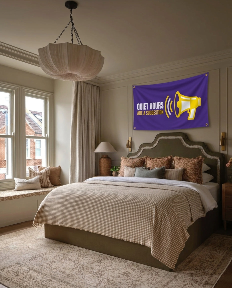 Quiet Hours Are A Suggestion dorm wall flag hanging in a bedroom
