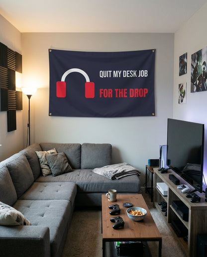 Quit My Desk Job For The Drop flag decorating a game room wall