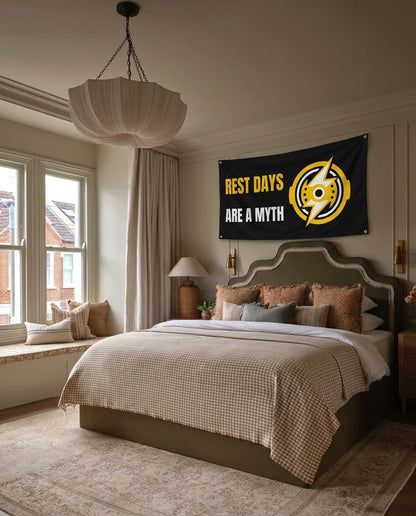 Rest Days Are A Myth gym wall flag hanging in a bedroom