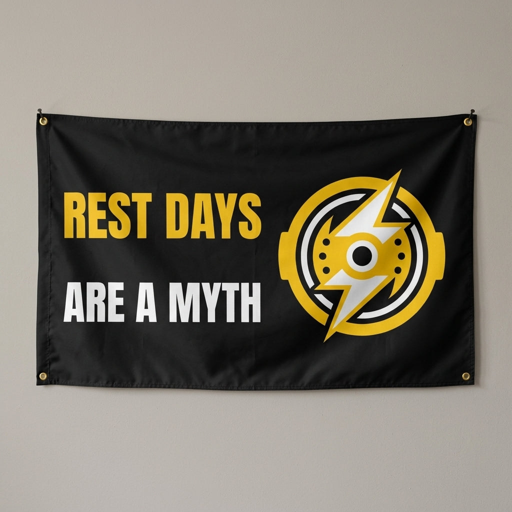 Rest Days Are A Myth flag 3x5 in black and yellow with a lightning bolt weight plate, hung on a wall
