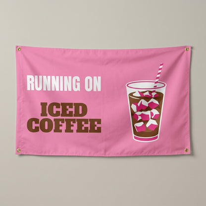 Running On Iced Coffee flag 3x5 in pink with a tall iced coffee cup, hung on a wall