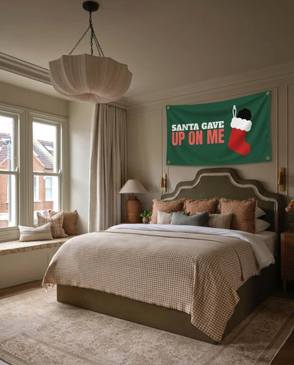 Santa Gave Up On Me Christmas wall flag hanging in a bedroom