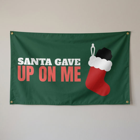 Santa Gave Up On Me flag 3x5 in dark green with a stocking full of coal, hung on a wall