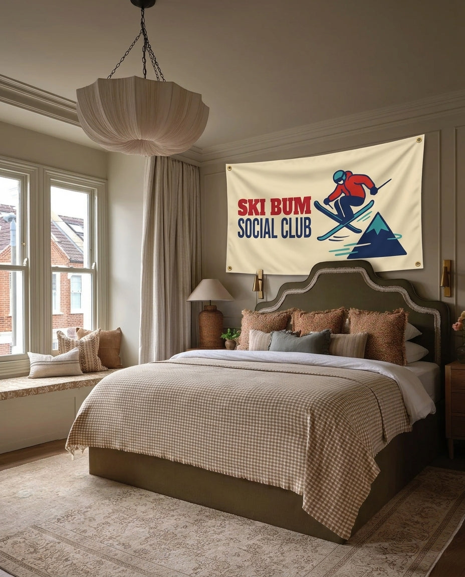 Ski Bum Social Club ski lodge wall flag hanging in a bedroom
