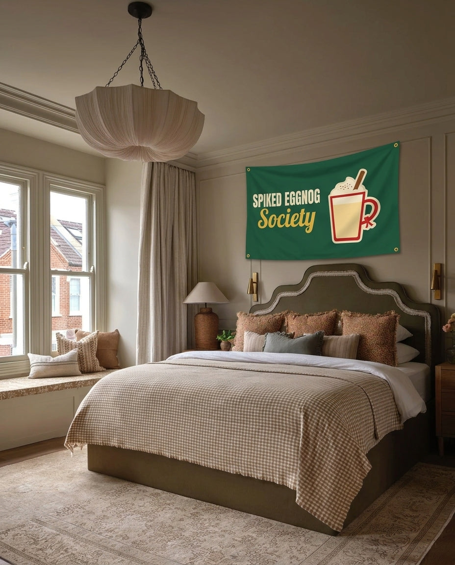 Spiked Eggnog Society Christmas wall flag hanging in a bedroom