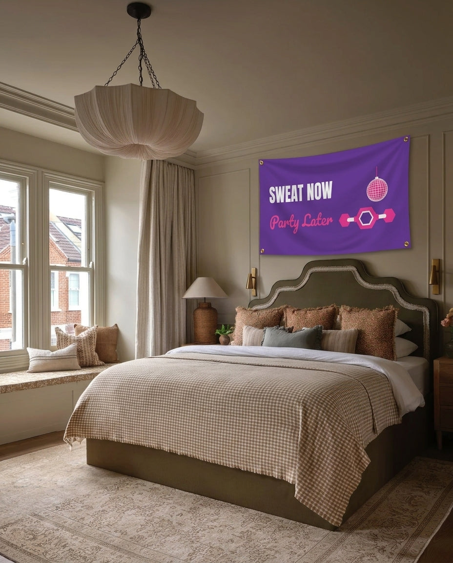 Sweat Now Party Later gym wall flag hanging in a bedroom