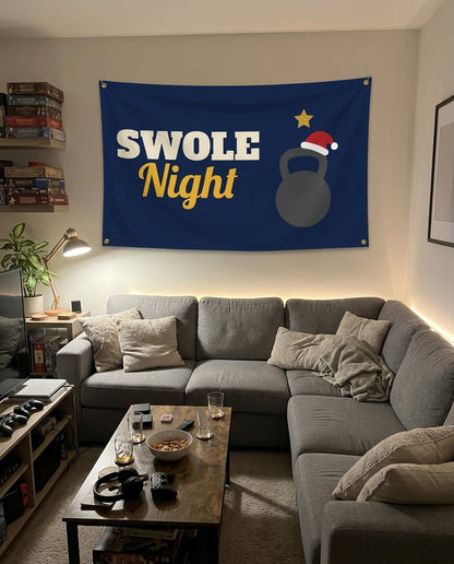 Holiday Gym Night flag decorating a game room wall