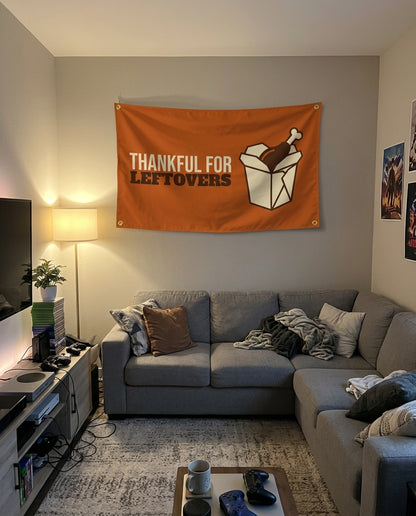 Thankful For Leftovers flag decorating a game room wall