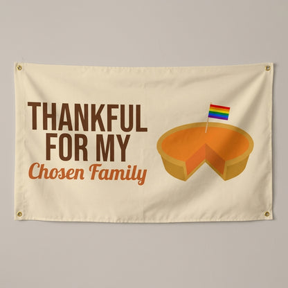 Thankful For My Chosen Family flag 3x5 in cream with a pie and a rainbow pick, hung on a wall