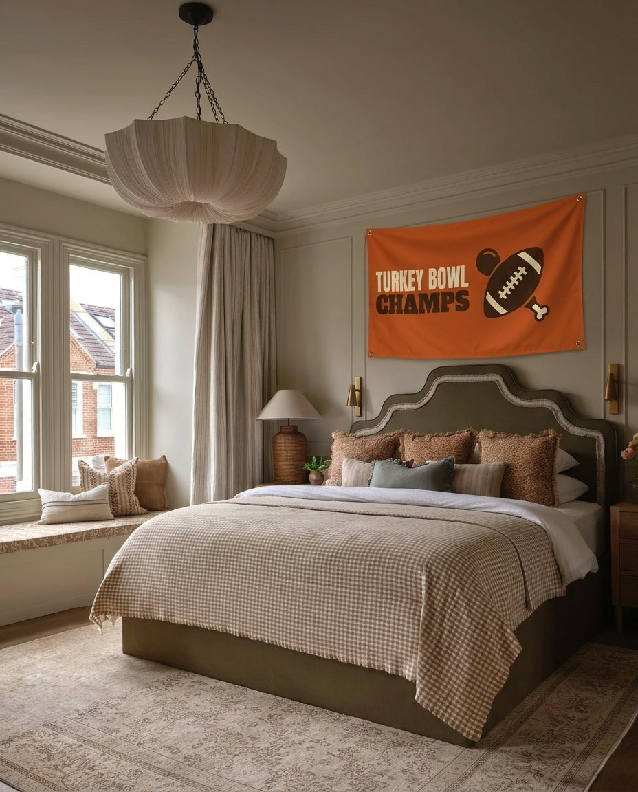 Turkey Bowl Champs Thanksgiving wall flag hanging in a bedroom