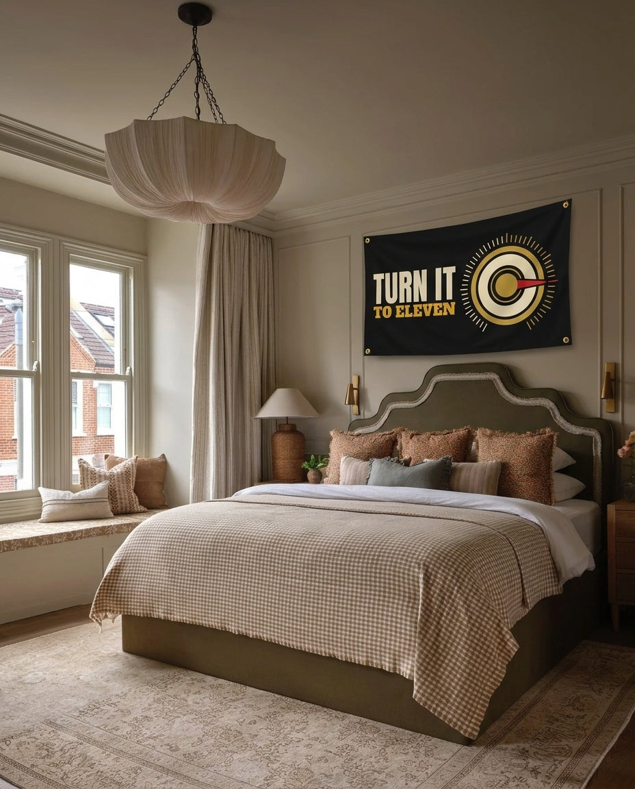 Turn It To Eleven music wall flag hanging in a bedroom